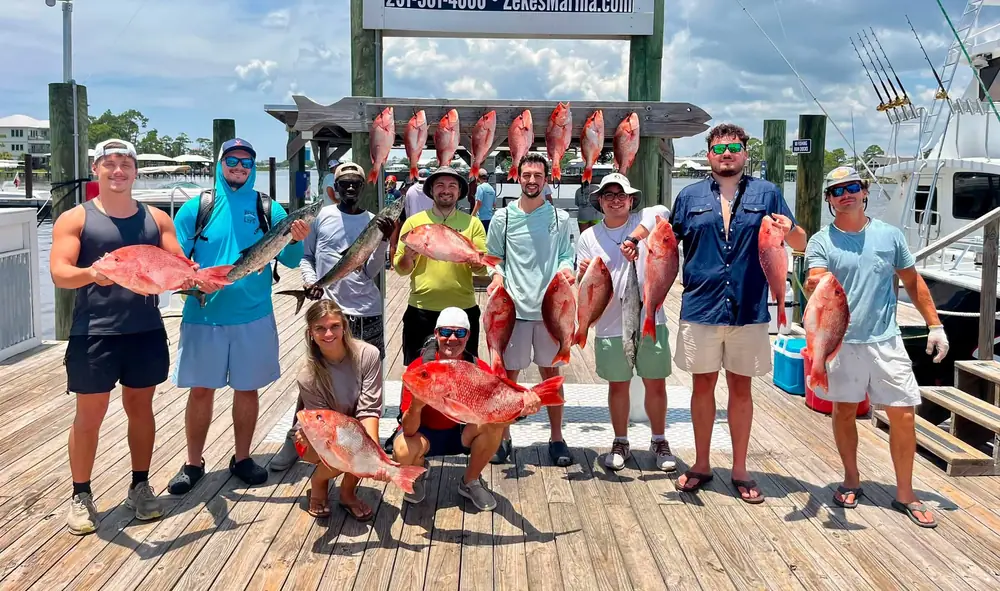 A group charter with red snapper on the Orange Beach dock