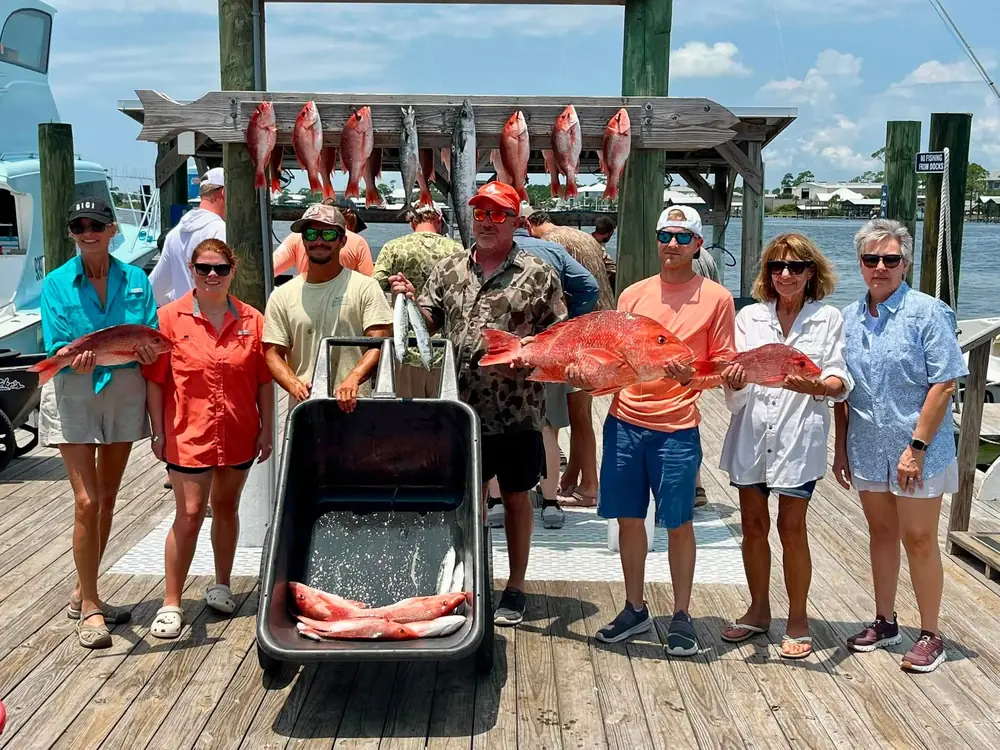 A large party with a loaded cart of red snapper