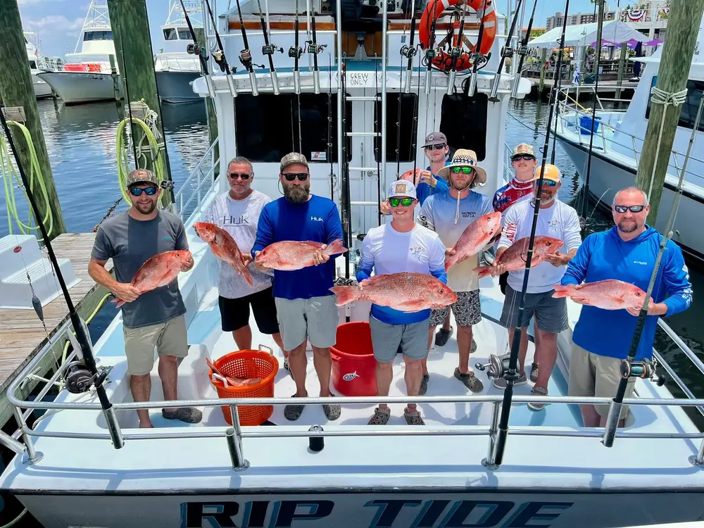 Guests aboard the Rip Tide with their catch