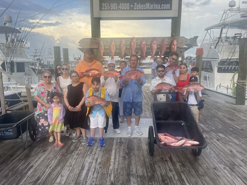 Kids and parents on the dock after a family fishing trip