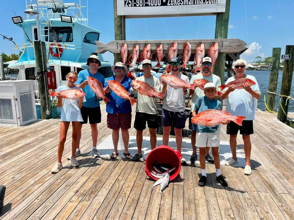 Anglers with red snapper hanging at Zeke's Landing