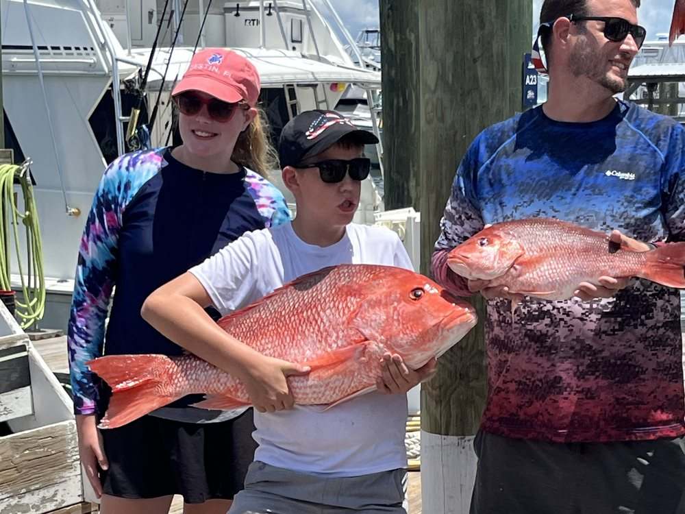 A pair of trophy red snapper on the dock at Zeke's Landing