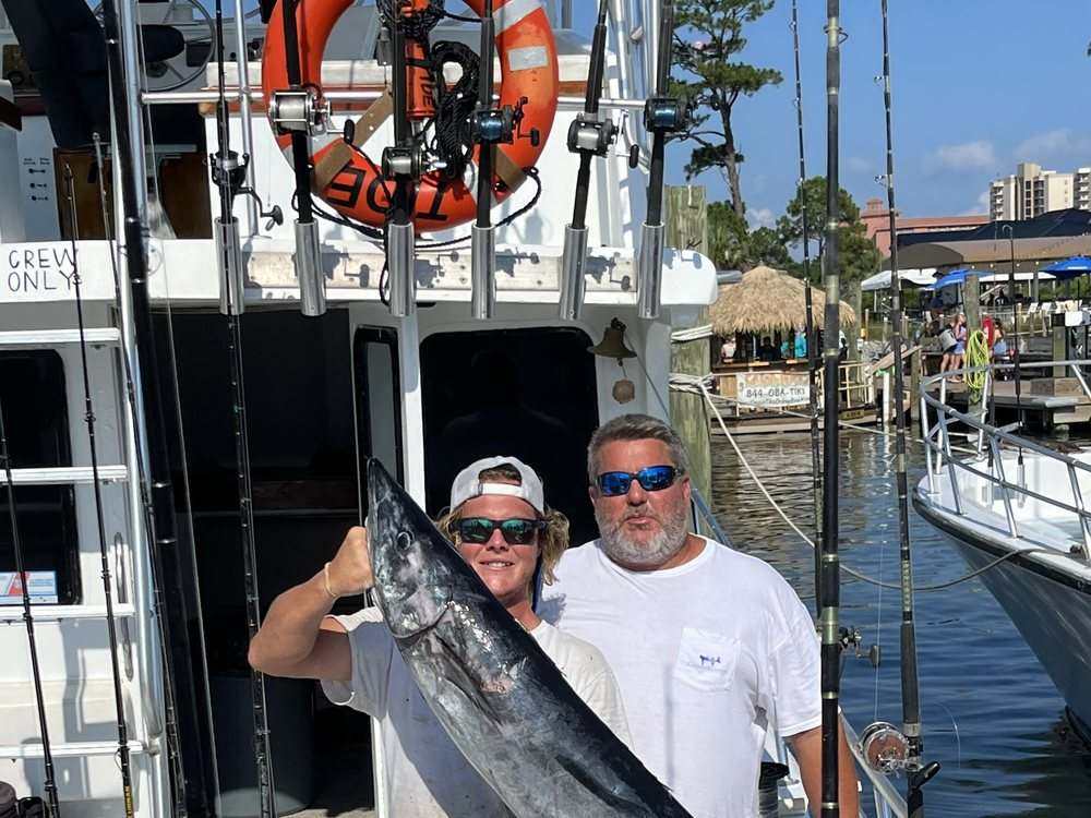 Anglers with a wahoo landed on the back deck